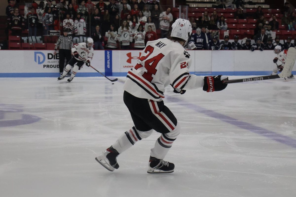 Senior defenseman Austen May skates down the ice Jan. 18. The Huskies completed their sweep of the University of New Hampshire at Walter Brown Arena.