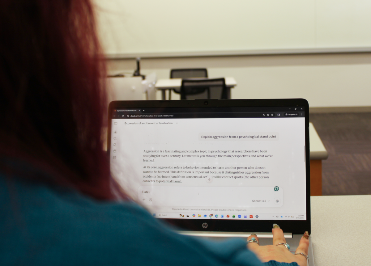 A student asks ChatGPT to expand on a topic while in class. Northeastern offered students a resource webpage to help them better navigate AI in the workplace.