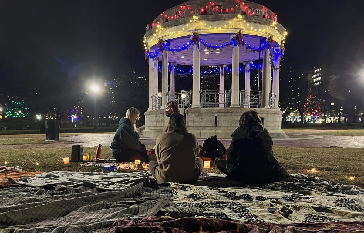 Protesters sit on blankets and meditate Jan. 14. The demonstration highlighted mindfulness in the midst of ICE action.