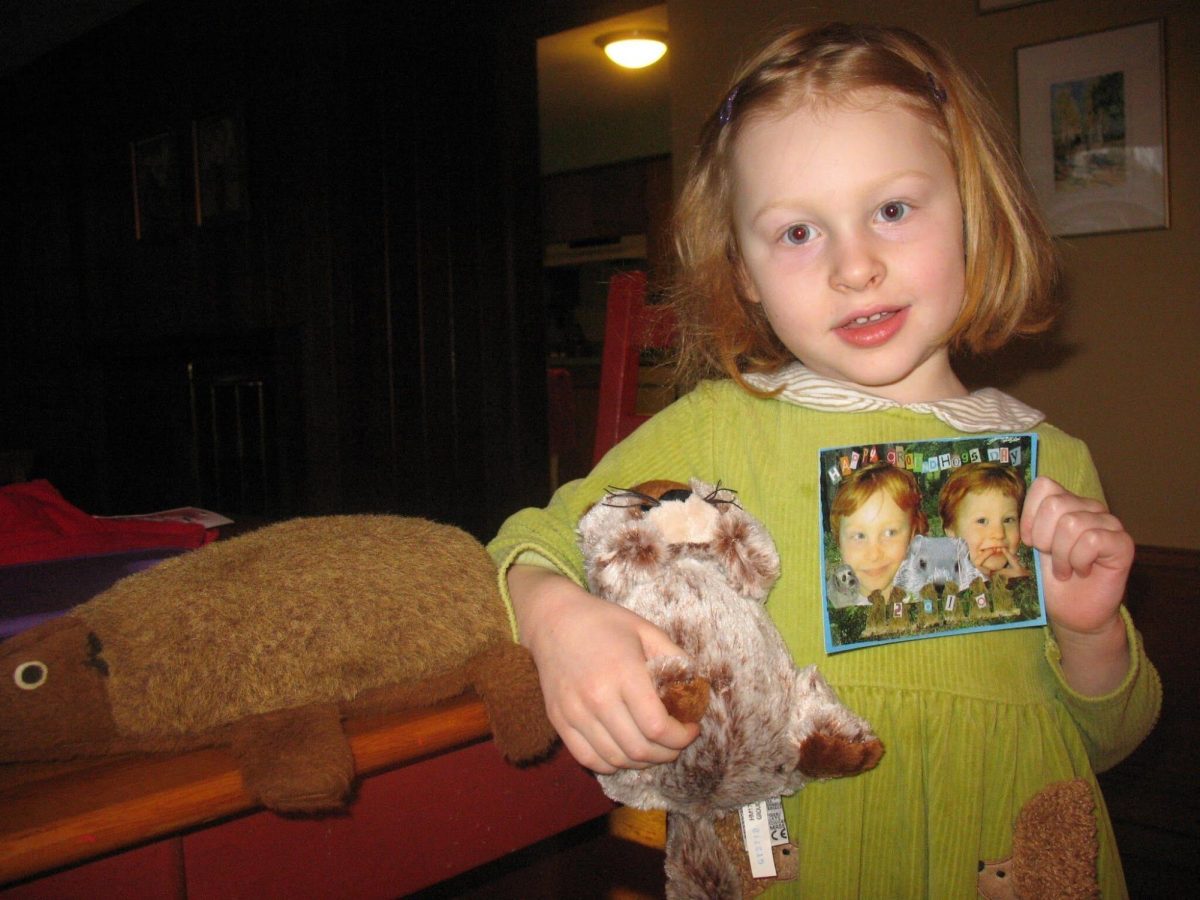 Image from IOS: A young Frances Klemm holds a custom Groundhog Day card and ground hog stuffed animal Feb. 2, 2010. The first time the holiday was mentioned in a newspaper was in 1887. Photo courtesy Frances Klemm.