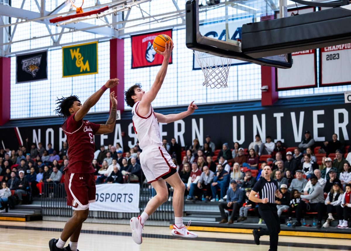 Junior guard Mike Loughnane goes up for a layup Jan. 31. Loughnane scored three points and collected a steal and a rebound against Hofstra Feb. 5.