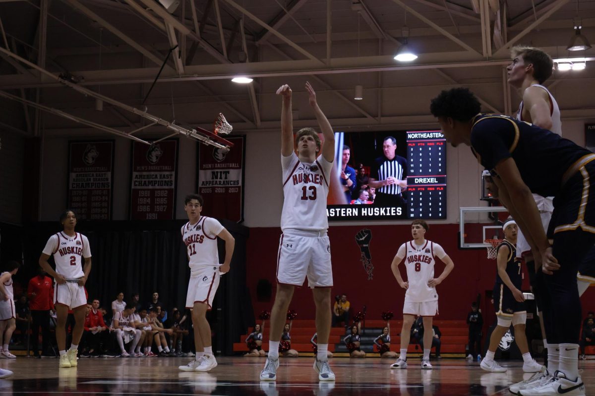 Sophomore guard Luca Soroa Schaller (center) takes a free throw Feb. 19. The Huskies lost 70-61 to the Drexel University Dragons.