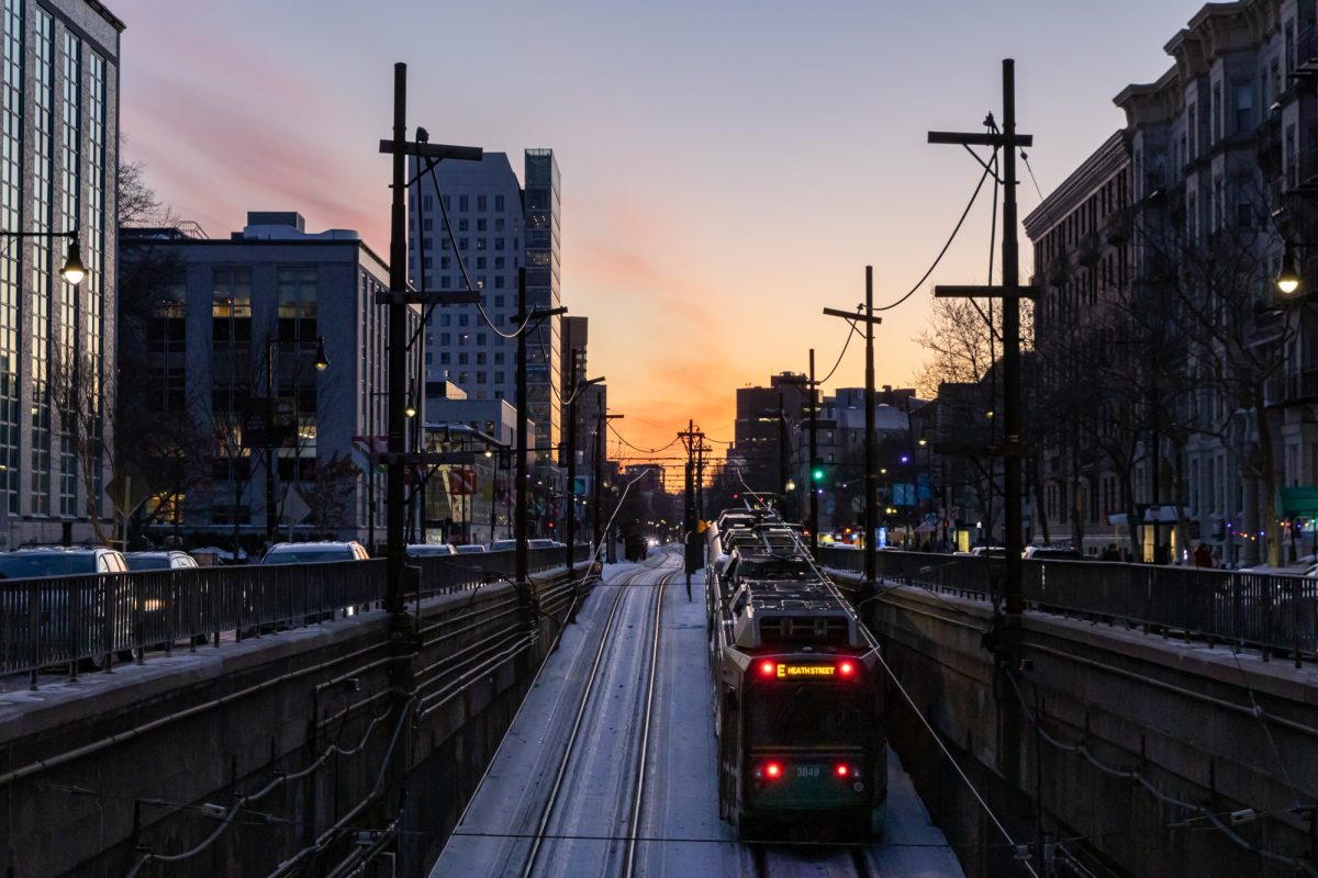 The Heath Street Green E Line ascends from underground to Huntington Avenue Jan. 31. The PILOT program slated an increase in Northeastern’s annual payments to the City of Boston for 2026.
