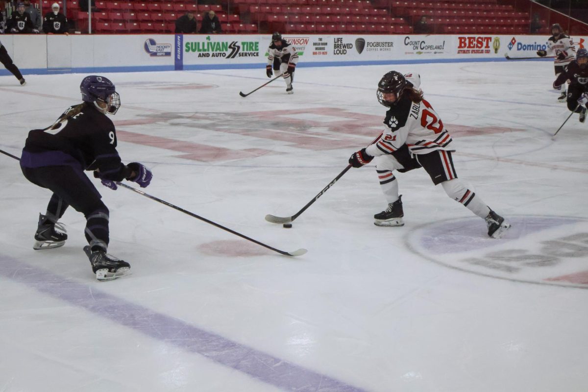 Stryker Zablocki approaches her opponent Jan. 29. Zablocki scored the fifth and final goal for Northeastern's victory of Maine Feb. 5.