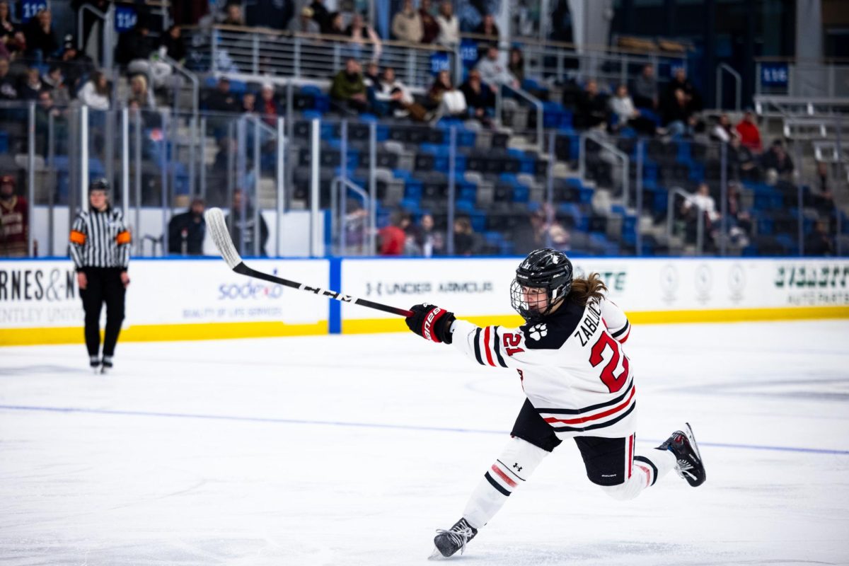 Freshman forward Stryker Zablocki shoots the puck at a game against Boston College Feb. 15. Read more here.
