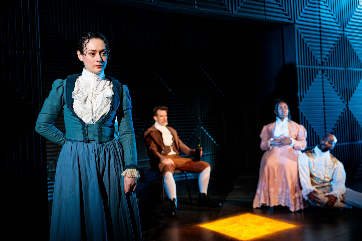 Woman 1 (Alison Russo) stands stoically in front of the cast. "The Antiquities" premiered to the public March 6. Photo courtesy Benjamin Rose Photography.