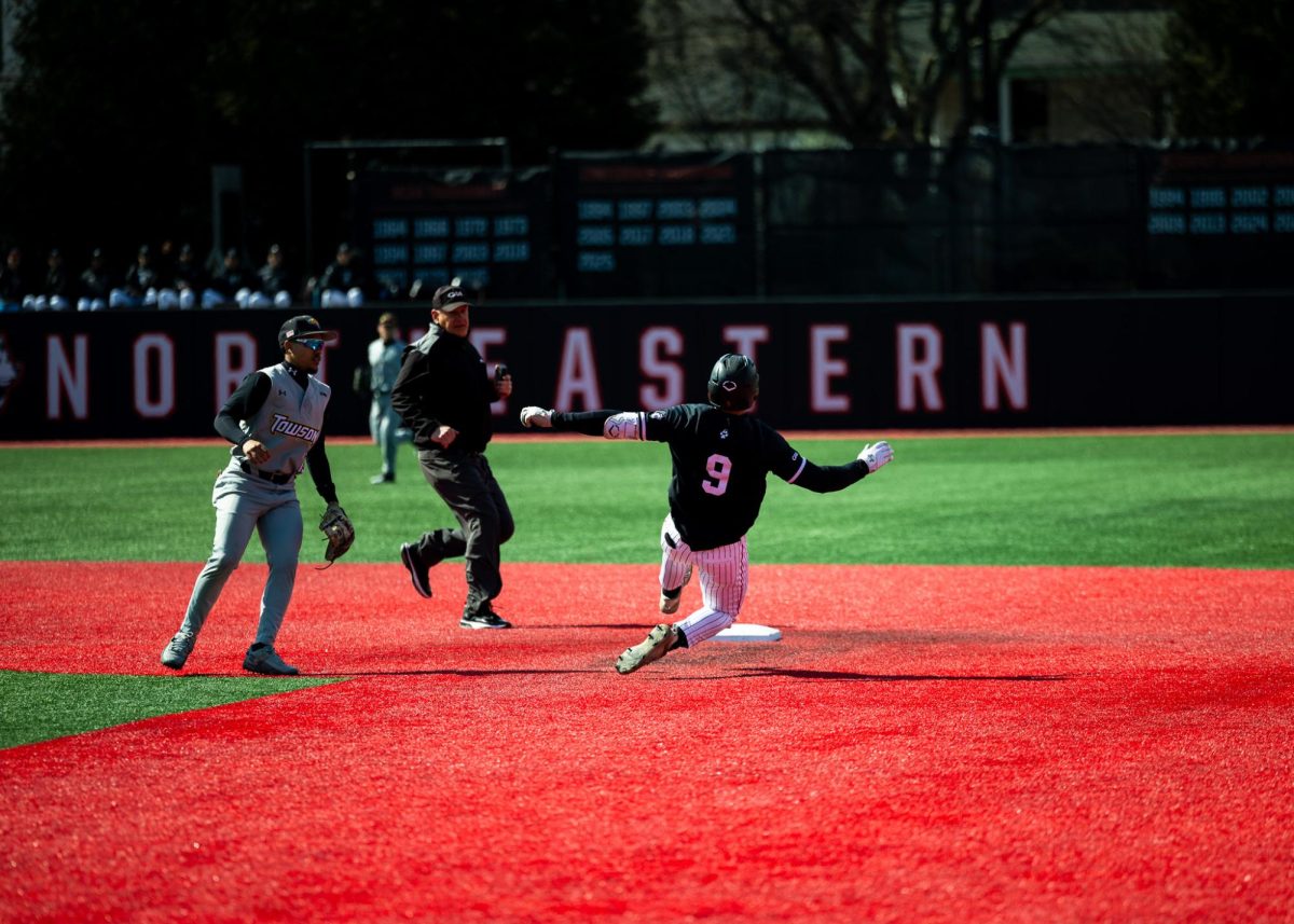 Redshirt senior left fielder Harrison Feinberg slides to second base March 14. Feinberg scored three runs against Brown March 18.