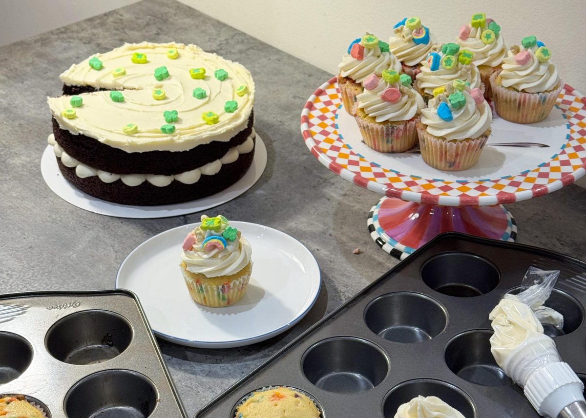 A collection of plated St. Patrick’s Day recipes sit on a table. The holiday called for green food coloring and Lucky Charms cereal to be incorporated into desserts. Emily Chung