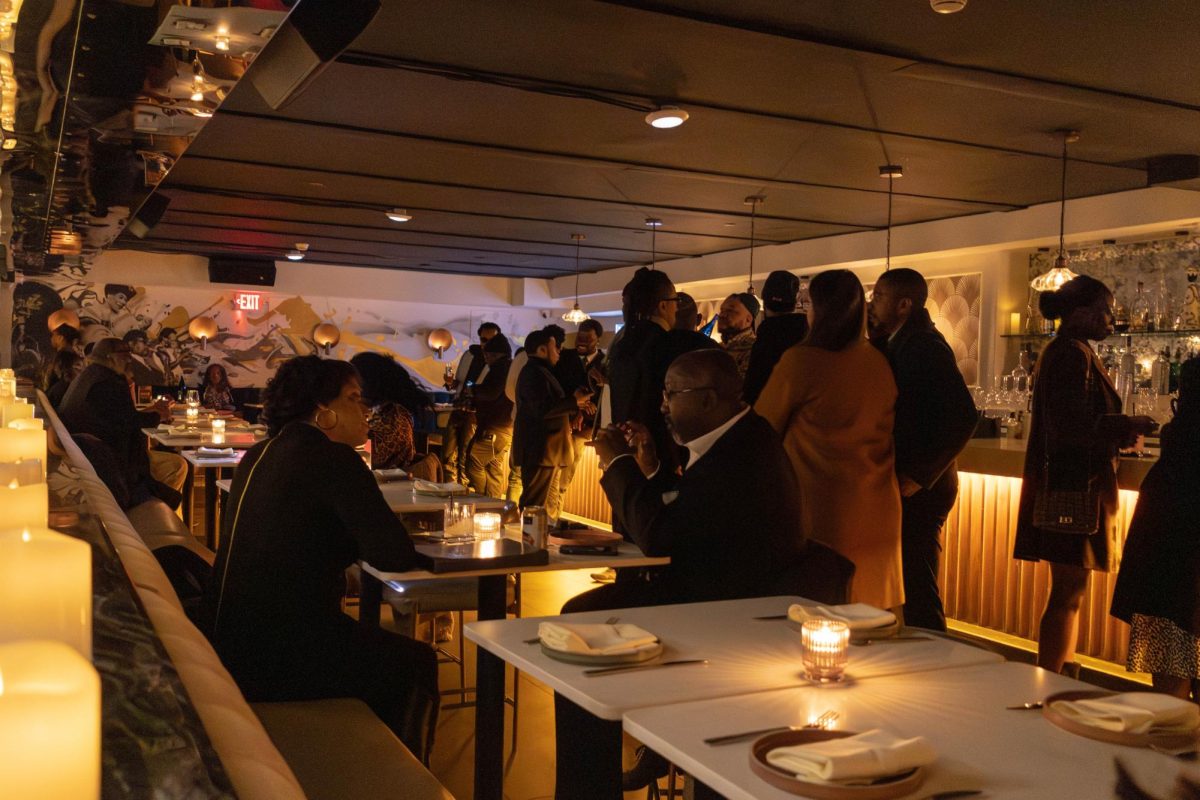 Attendees mingle with one another before the official start of the Legacy 100 Celebration Feb. 27. Boston elected officials, community leaders, high school students and college graduates gathered to celebrate the 100th anniversary of Black History month.