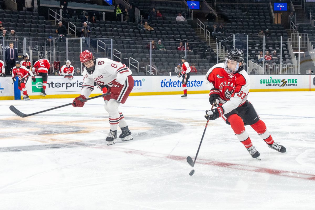 Freshman forward Amine Hajibi brings the puck down the ice at the Beanpot Consolation game Feb. 9. Hajibi scored the third goal in the 4-2 victory over BC March 7.