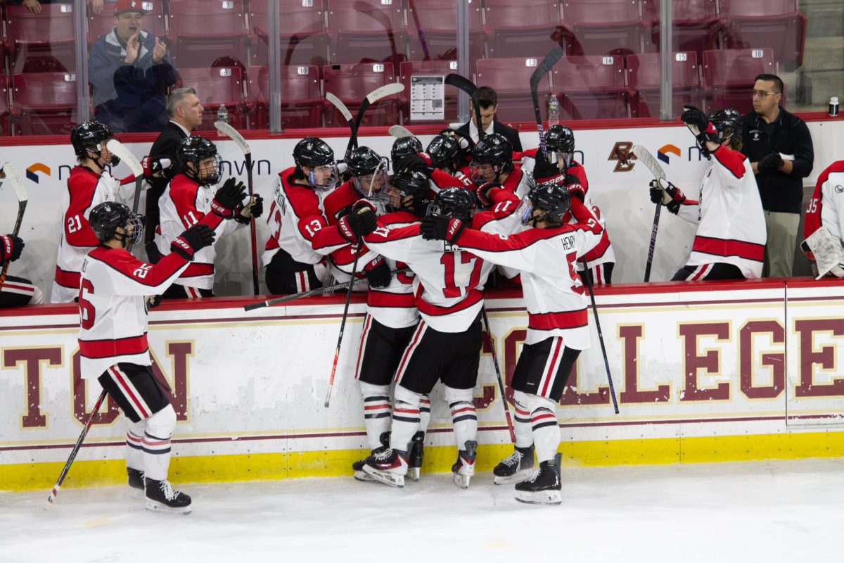 Northeastern celebrates a goal March 11. The team defeated UNH 7-3 in the Hockey East tournament opening round.