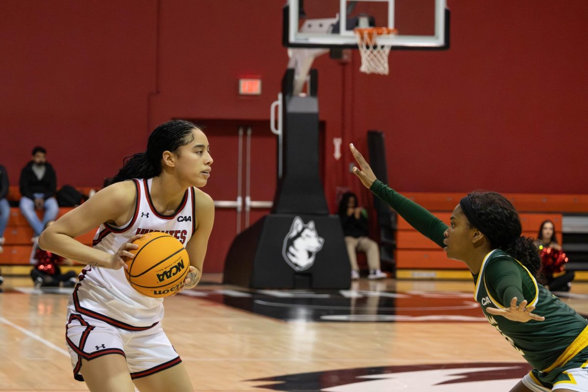 Freshman guard Kailee Beaudion-Foliaki holds the ball away from her opponent before making a move Jan. 23. Northeastern fell in their final regular season game to Hofstra 62-46 March 7.