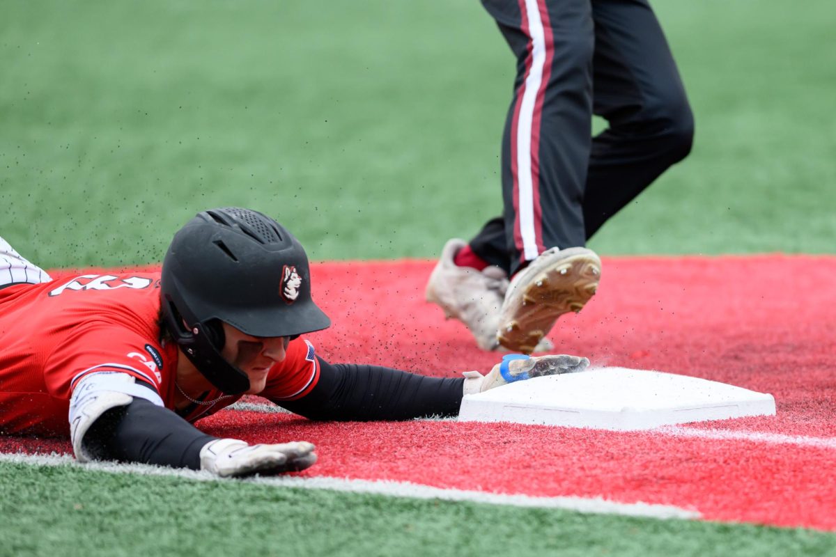 Junior outfielder Ryan Gerety dives for the plate during a game against Elon University March 22. Read more here.