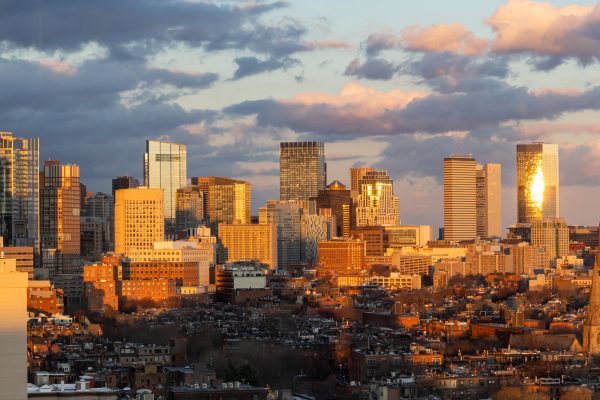 Golden hour light shines on Boston's cityscape Jan. 16. Using various architectural drawings and models, Averneck's new book, which will be released in July, examined rapid urbanization and housing crises in cities throughout the world.