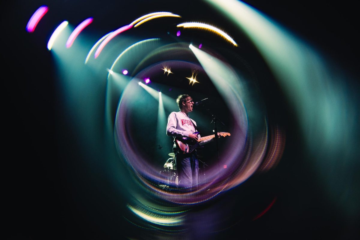 Malcolm Todd sings out to a cheering Northeastern crowd while surrounded by a blurry, star-like filter March 28. Beno and Cherry Crisis opened the Springfest Concert. Photo courtesy Northeastern CUP.
