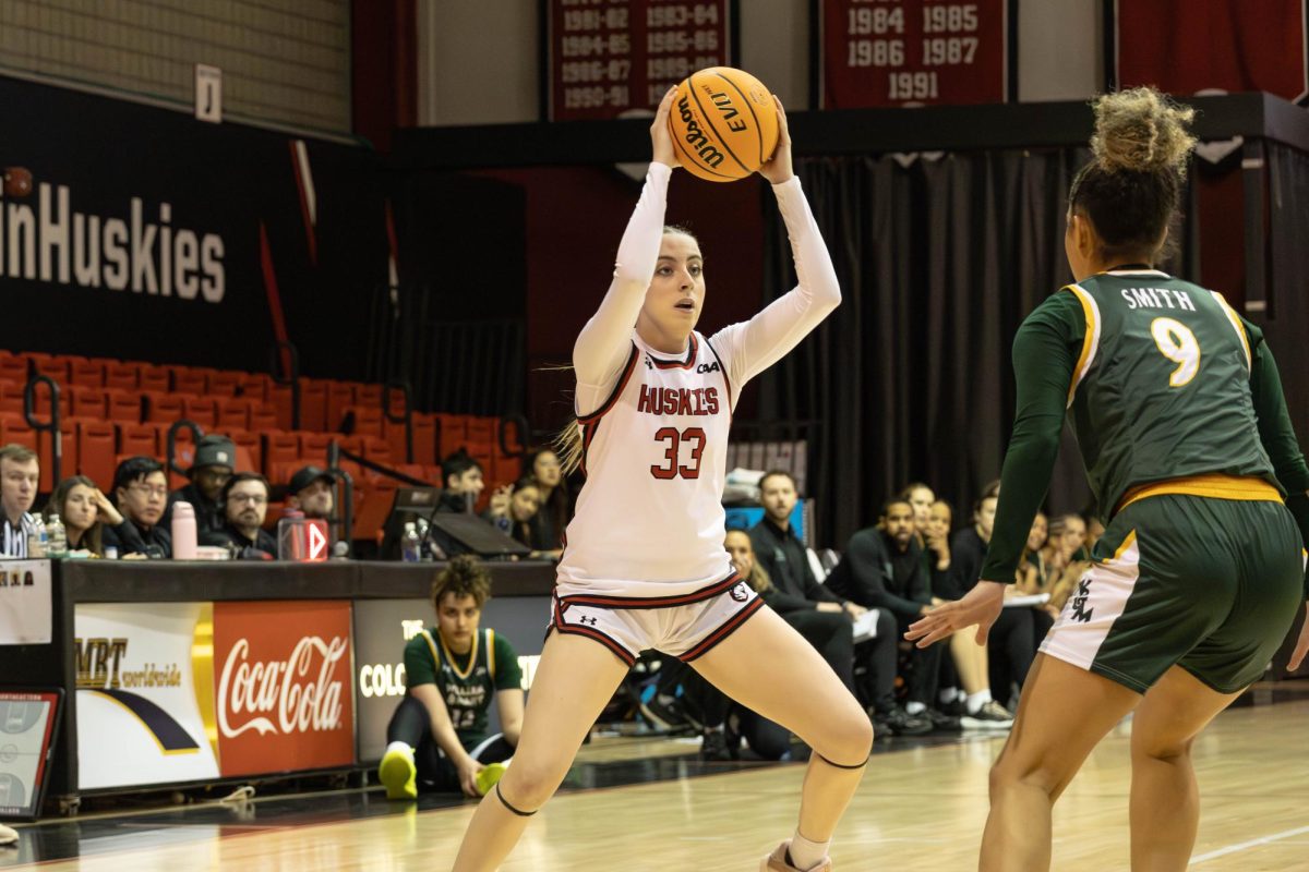 Sophomore guard María Sánchez Pitarch holds the ball away from her defender in a game Jan. 23. Pitarch is the first women's basketball player to enter the portal this season.