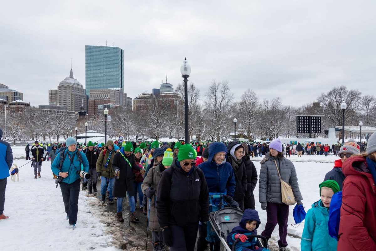 Bostonians walk across a snowy Boston Common to bring awareness about homelessness and raise money for the cause Feb. 8, 2025. The event raised thousands of dollars for local nonprofits.