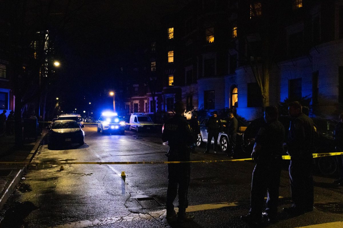 Police officers and caution tape block off an area of the Gainsborough and Hemenway streets intersection April 1. Students felt concerned by the university's lack of communication and accountability towards the assaults. 
