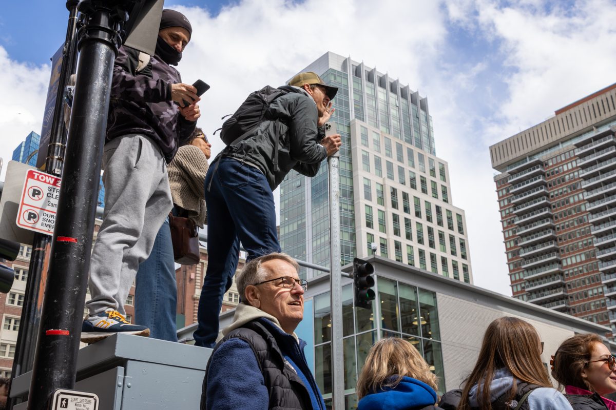 A spectator cheers for a friend approaching the finish line on Boylston Street during the Boston Marathon April 20. Read more here.