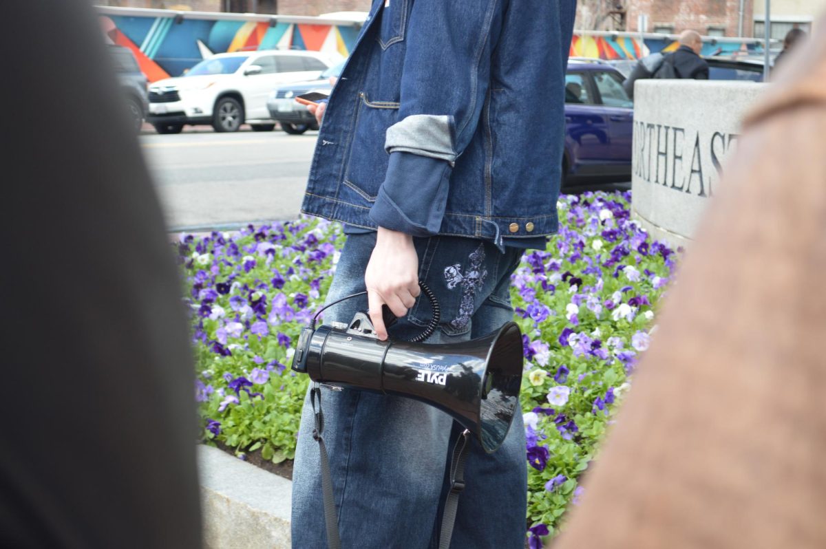 Jeffrey Franchetti holds a megaphone at a rally for administrative transparency in front of the Marino Recreation Center April 6. Read more here.
