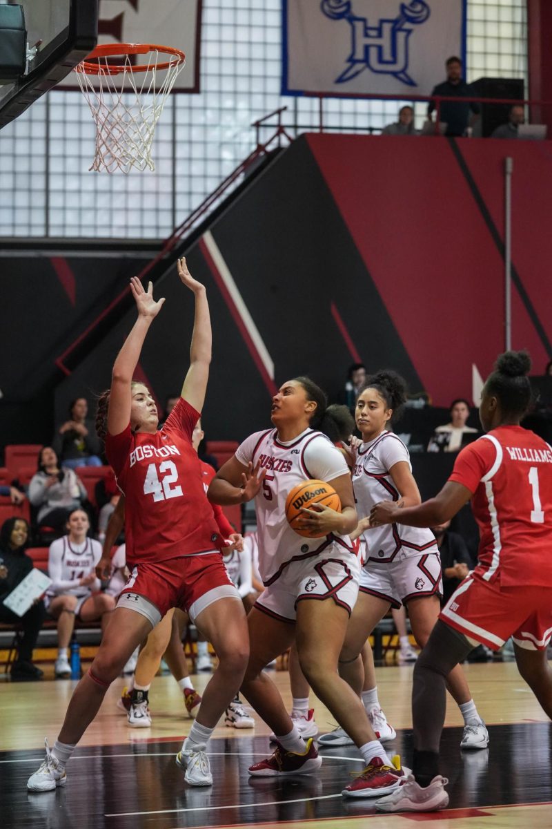 Tramble faces a BU player in her attempt to put the ball in the basket Nov. 11, 2025. Tramble ended the season with 168 rebounds.