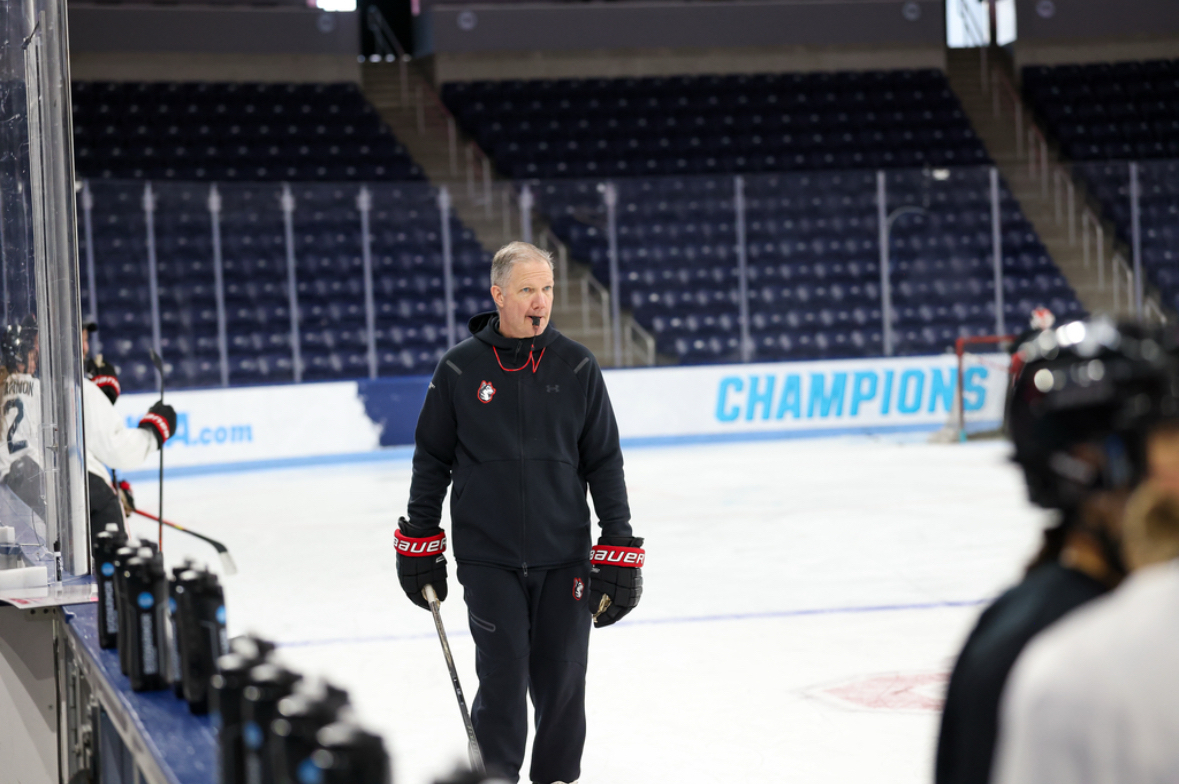 Coach Dave Flint walks down the ice. Northeastern announced Flint’s multi-year contract extension June 3. Photo courtesy Jim Pierce.