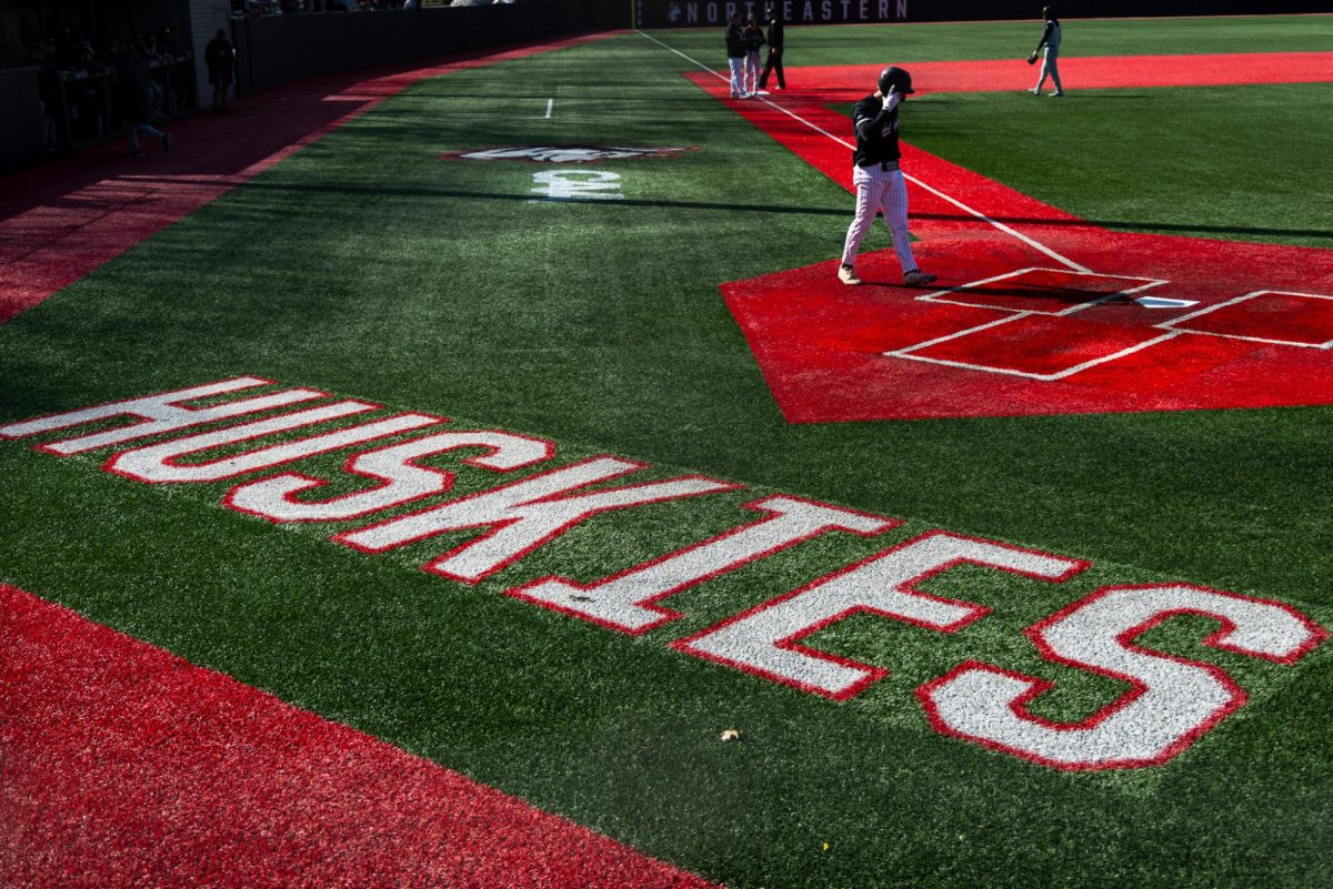 The Huskies warm-up before their game against Towson March 14. BetMGM listed Northeastern baseball's game against Campbell University on its app last year, resulting in a fine.